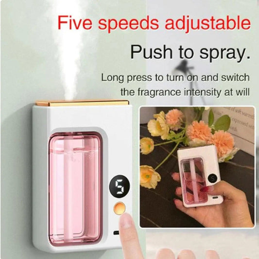 Wall-mounted fragrance diffuser with digital display and spray mechanism, featuring text on adjustable speeds and operation.